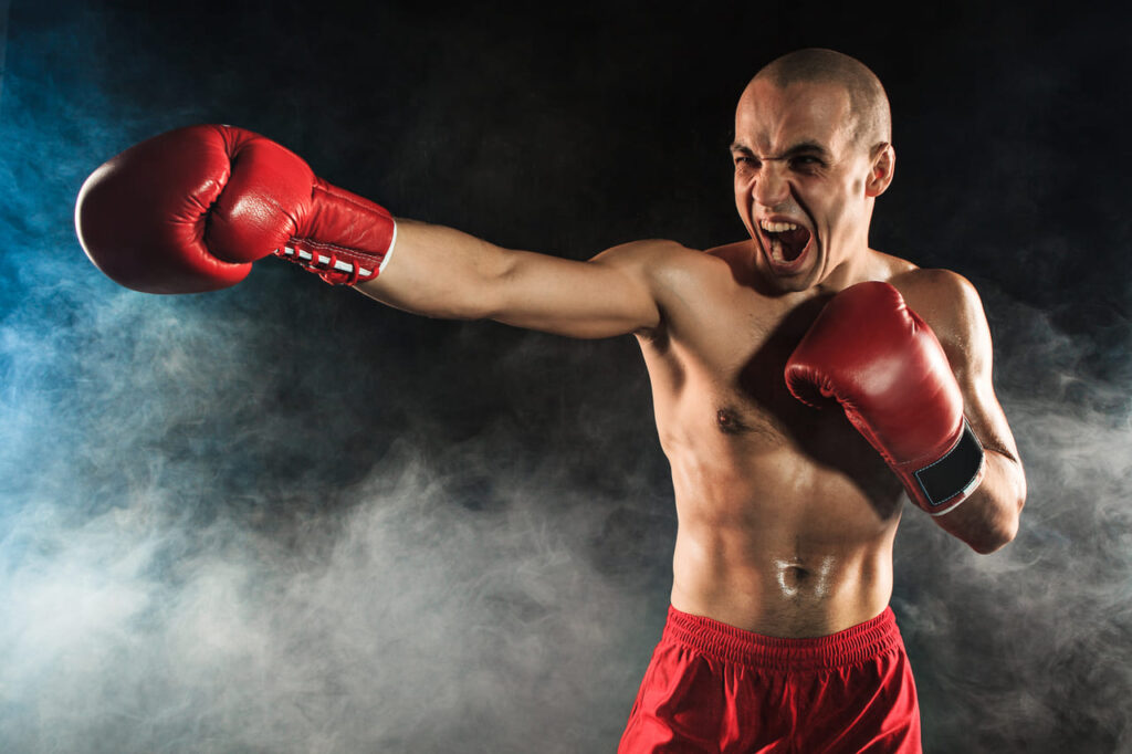 the-young-man-kickboxing-in-blue-smoke (1)